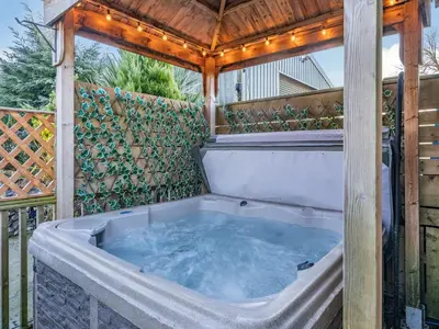 a hot tub in a gazebo on a patio at Ferndale Bungalow in Hambleton
