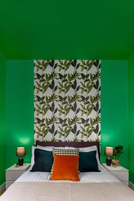 a green bedroom with a bed with a green wall at Hornsey House - Air Host & Stay - 5 Bedrooms Sleeps 10 in Liverpool