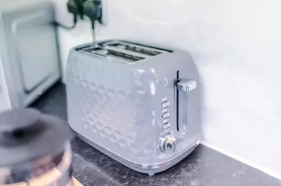 a toaster sitting on a counter in a kitchen at Trendy house, close to stadiums, free wifi and car park in Liverpool