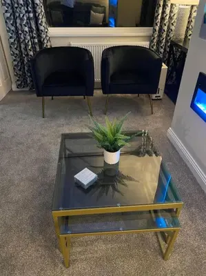 a living room with two chairs and a coffee table at Wharfedale Lodge- Bungalow-3 Bed, 2 bath, Amazing! in Thornton