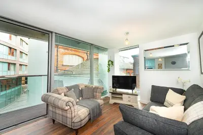 a living room with two couches and a tv at Free Parking Modern Balcony 2 Bed City Centre in Liverpool