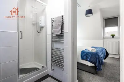 a bathroom with a walk in shower and a walk in shower at Stylish 3-Bed Sleeps 8 Liverpool free wifi carpark By Hinkley Homes Short Lets & Serviced Accommodation in Liverpool