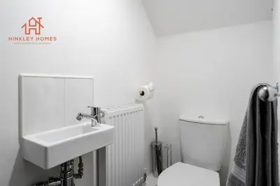 a bathroom with a sink and a toilet at Stylish 3-Bed Sleeps 8 Liverpool free wifi carpark By Hinkley Homes Short Lets & Serviced Accommodation in Liverpool