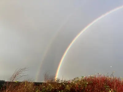 a double rainbow in the sky over a field at The Pleasant Hut at Mount Pleasant Farm in Ulverston