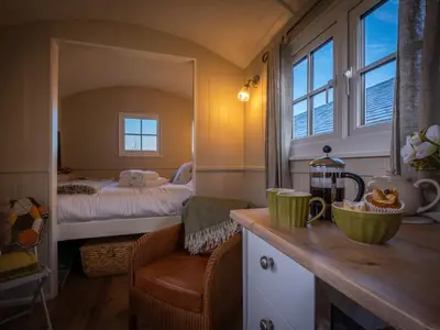 a small room with a bedroom with a bed at The Pleasant Hut at Mount Pleasant Farm in Ulverston