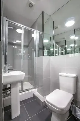 a bathroom with a toilet and a shower and a sink at The V.I.P Suite - Sleeps 24! Best for large groups in Liverpool
