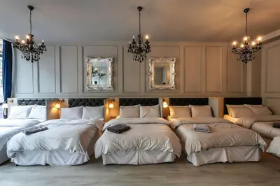 a group of beds in a room with mirrors at The V.I.P Suite - Sleeps 24! Best for large groups in Liverpool