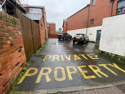a parking space with the words runyon priority at The Fort Lytham St Annes in Lytham St Annes