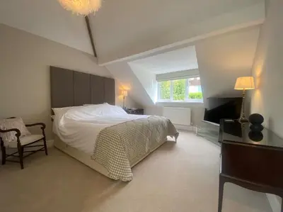 a bedroom with a large bed and a window at Beautiful 1 bedroom holiday home in Lancaster in Lancaster
