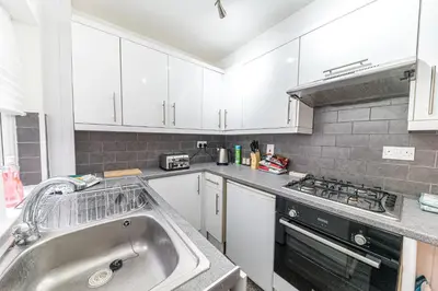 a kitchen with a sink and a stove at *King Bed* Comfy City House in Barrow in Furness