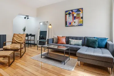 a living room with a couch and a table at Wrights Terrace - Air Host and Stay - 4 Bedroom in Liverpool