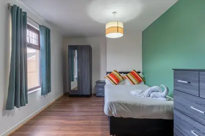 a bedroom with a bed and a large window at 