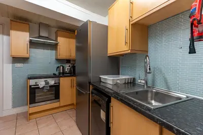 a kitchen with wooden cabinets and a sink at 