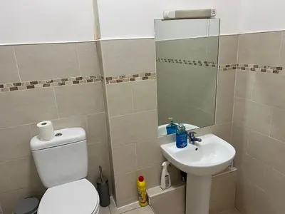 a bathroom with a toilet and a sink at 2 bedroom city centre apartment 35 Victoria street in Liverpool