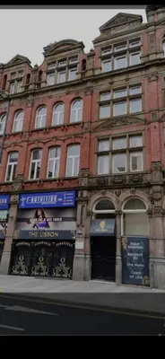 a large brick building on the side of a street at 2 bedroom city centre apartment 35 Victoria street in Liverpool