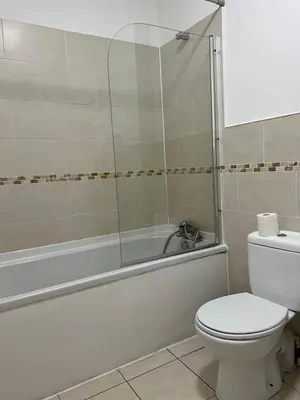 a bathroom with a shower and a toilet and a tub at 2 bedroom city centre apartment 35 Victoria street in Liverpool