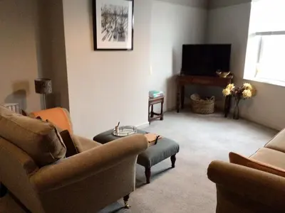 a living room with two couches and a tv at Smart self-catering apartment, Clitheroe in Clitheroe