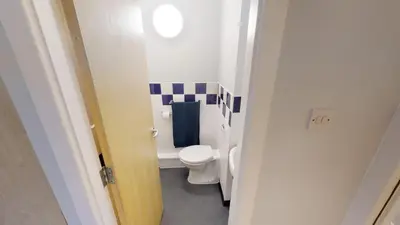 a small bathroom with a toilet in a room at iQ Great Newton House in Liverpool in Liverpool