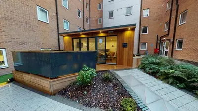 a house with a building and a courtyard at iQ Great Newton House in Liverpool in Liverpool