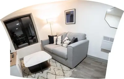 a living room with a couch and a table at Contemporary 1 Bed Apartment in Central Liverpool in Liverpool