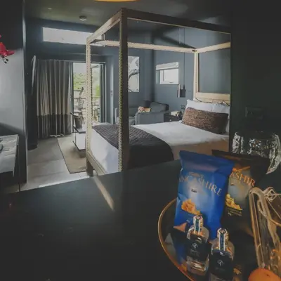a bedroom with a large bed with a canopy bed at Everything Retreat in Mellor