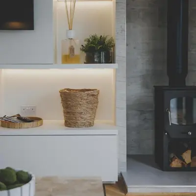 a fireplace in a living room with a stove at Everything Retreat in Mellor