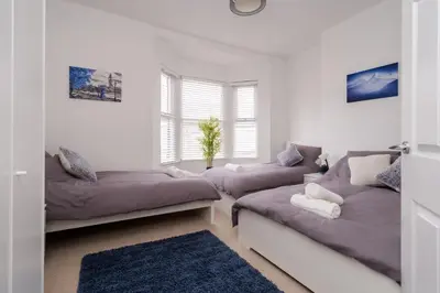 a living room with two couches and a couch at DENEBANK LODGE - Strictly NO Parties in Liverpool