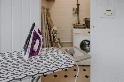 a kitchen with a table with a purple object on it at The Pheasant Lodge Spacious Georgian Apartment with Log Fire and Garden Views in Grange Over Sands