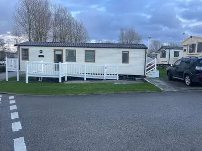 a white mobile home with a porch and a driveway at Luxury 6 Berth Caravan, Marton Mere in Blackpool