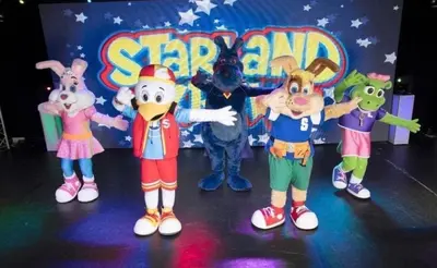 a group of cartoon characters on a stage at LA07 Oceanview in Morecambe