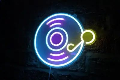 a neon sign that is on a brick wall at Button Street by UStay Aparthotels in Liverpool