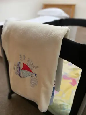 a towel is hanging on the back of a chair at Hodder Cottage in The Ribble Valley in Whalley