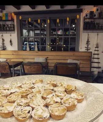 a plate of cupcakes on a table in a restaurant at 'Mill Cottage' Parbold in Parbold