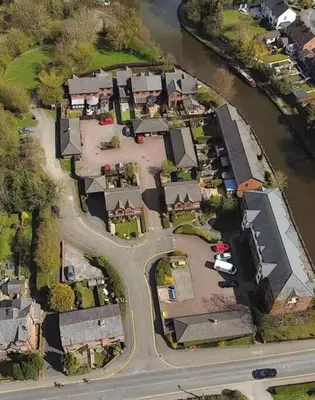 an overhead view of a suburb with a river and houses at 'Mill Cottage' Parbold in Parbold
