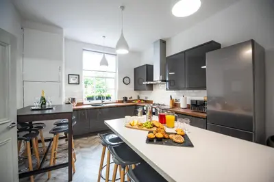 a kitchen with a table with a tray of food on it at Liverpool Georgian Town House Catharine St in Liverpool