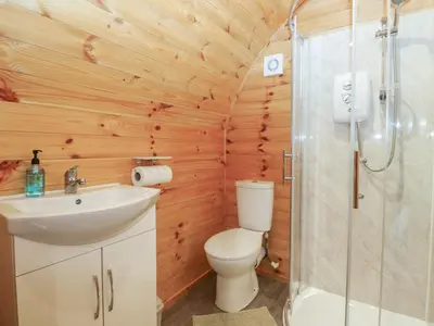 a bathroom with a toilet and a sink and a shower at Oak in Ulverston