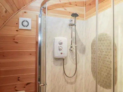 a shower in a bathroom with a glass door at Willow in Ulverston