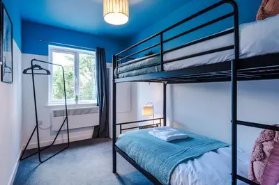 a bedroom with two bunk beds and a window at Formby Village Apartments By Greenstay Serviced Accommodation - Perfect For SHORT & LONG STAYS - Couples, Friends, Families & Business Travellers All Welcome - Dog Friendly - 7 in Formby
