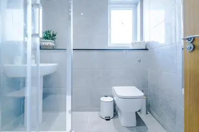 a white bathroom with a toilet and a sink at Formby Village Apartments By Greenstay Serviced Accommodation - Perfect For SHORT & LONG STAYS - Couples, Friends, Families & Business Travellers All Welcome - Dog Friendly - 7 in Formby