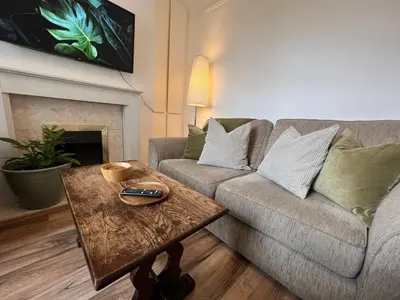a living room with a couch and a coffee table at 2025 Award Winner Liverpool Ivy House - 4 Bedrooms in Liverpool