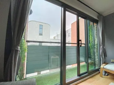 a room with a large window with a view at Liverpool One Beautifully Presented 2 Bedroom Apartment in Liverpool