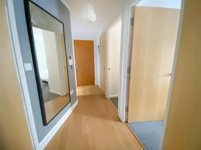 an empty hallway with a large mirror in a room at Liverpool One Beautifully Presented 2 Bedroom Apartment in Liverpool