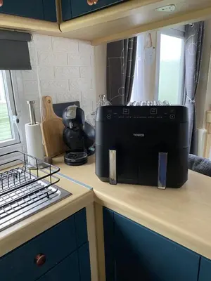 a black appliance sitting on top of a kitchen counter at Bobbys Bolthole2 in Heysham