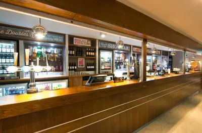a bar with a long counter in a restaurant at Bobbys Bolthole2 in Heysham