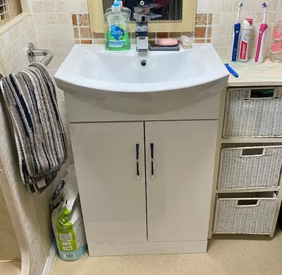 a bathroom with a sink and a white cabinet at Bobbys Bolthole2 in Heysham