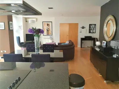 a living room with a couch and a table at Luxury Apartment Best location in Liverpool city center in Liverpool