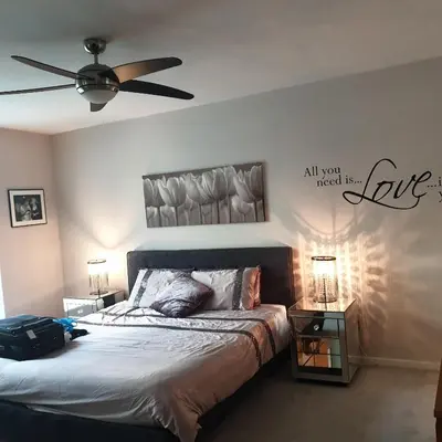 a bedroom with a bed and a ceiling fan at Luxury Apartment Best location in Liverpool city center in Liverpool