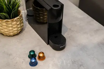 a black appliance sitting on a counter with some figurines at Fabulous Quayside Apartment with Free Parking in Liverpool