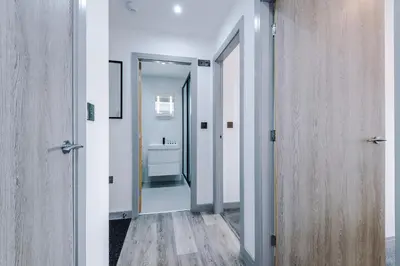 an open hallway with a bathroom with a sink at Charles House by Guestz in Preston
