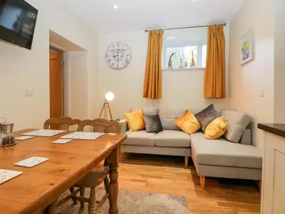 a living room with a couch and a table at Granary in Ulverston